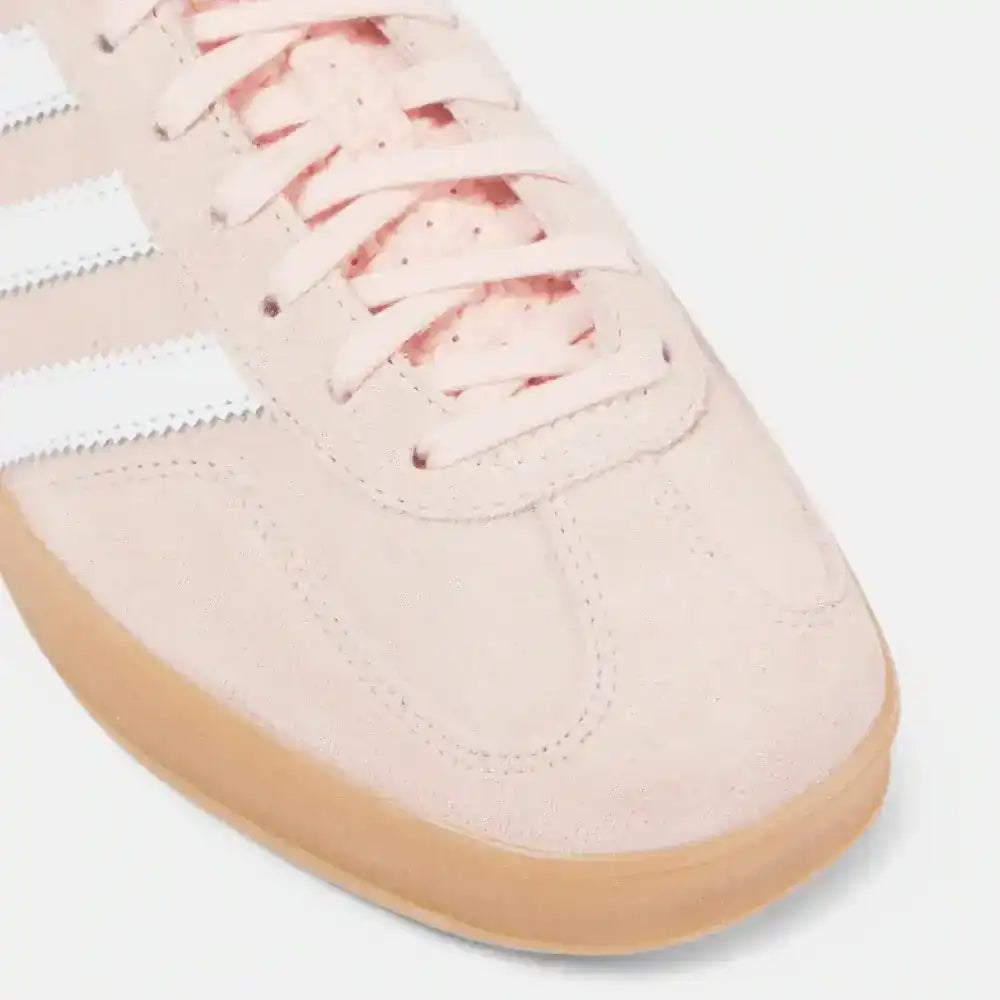 Close-up detail of Adidas Gazelle light pink suede material and gum sole